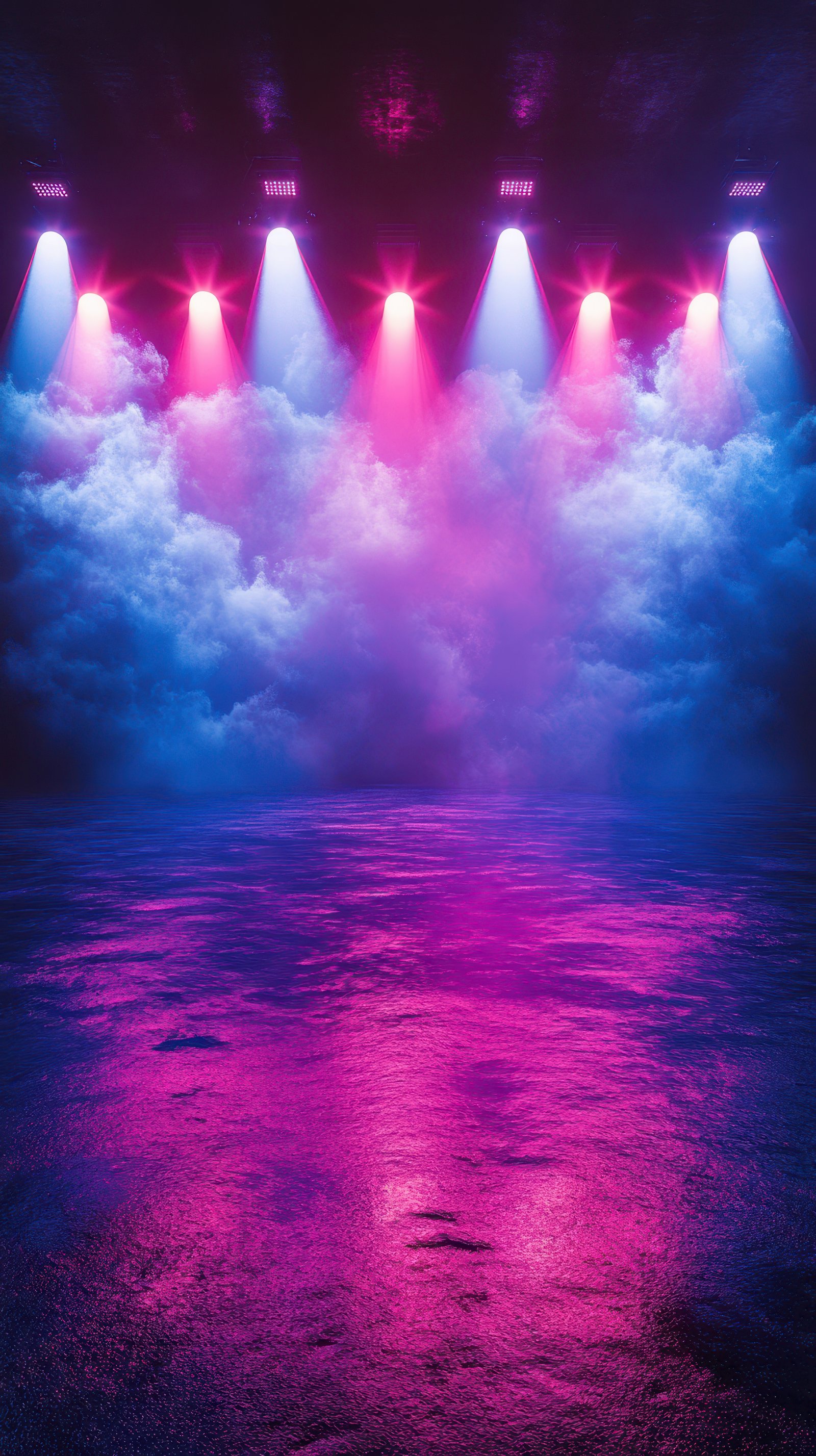 Dramatic light display over misty ground creates an energetic atmosphere in a performance setting